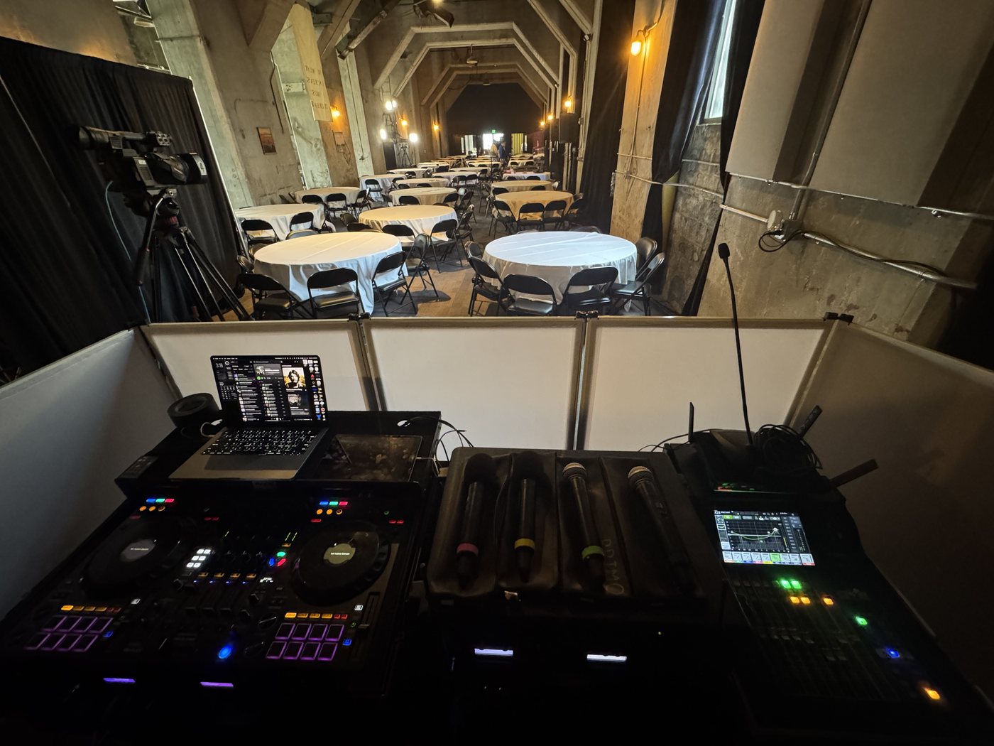 A Primo booth with wireless microphones lined up and ready before a corporate event